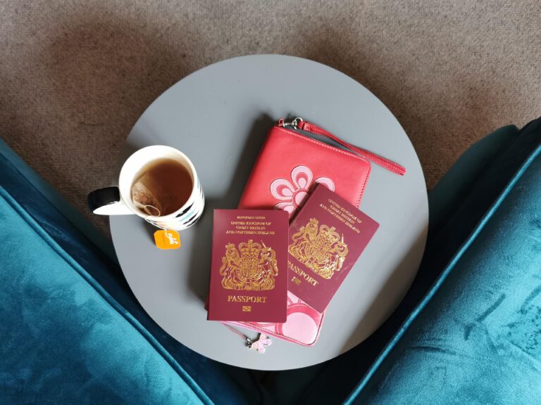 passports and cup of tea on table